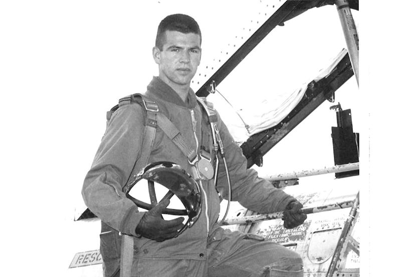 Dr. Pierre Morisset climbing into an aircraft.
