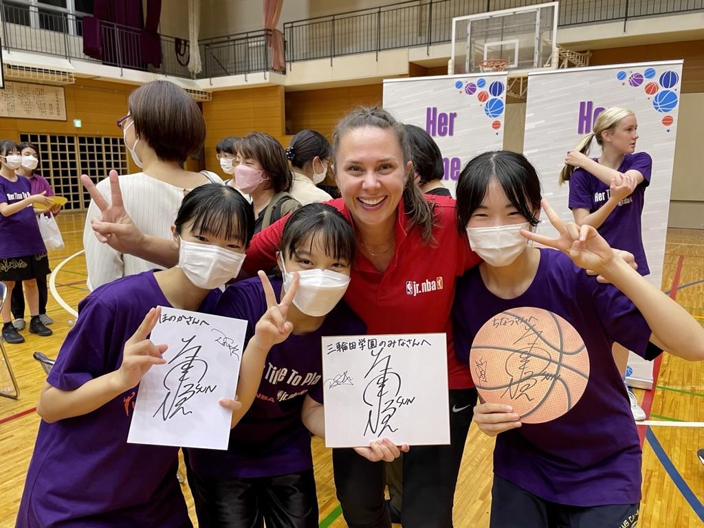 Dawn Smyth with young basketball players in Japan.