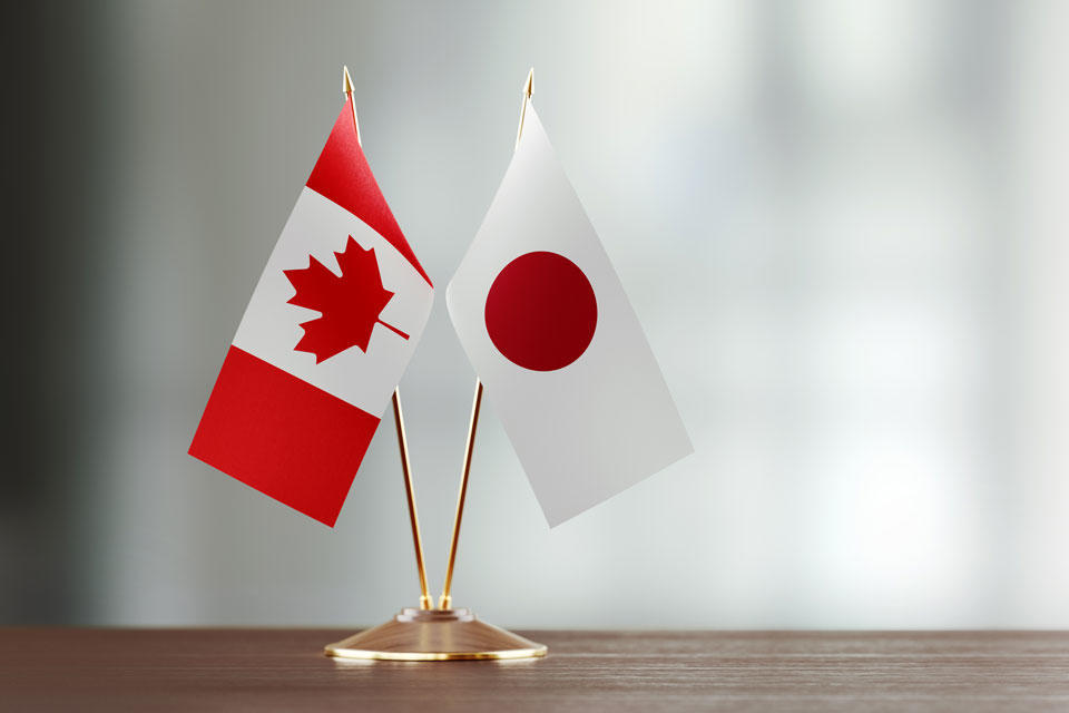 Flags of Canada and Japan on a table