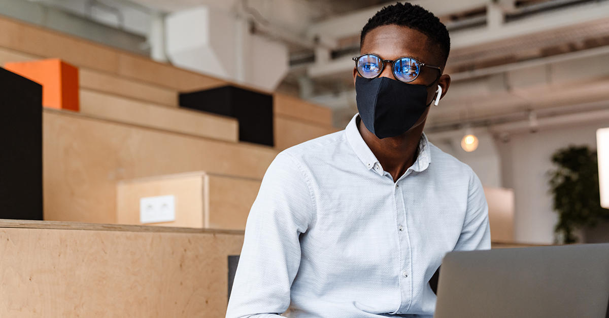 confident African student wearing a medical mask