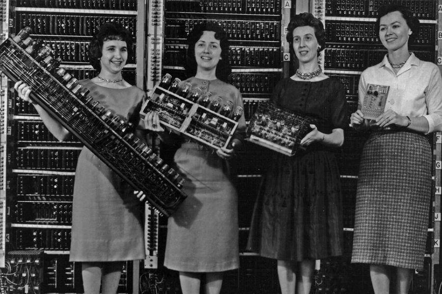 Archive photo of students holding equipment.