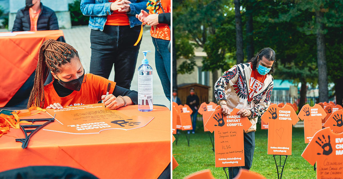 Students writing messages on orange shirt signs and planting them in the grass