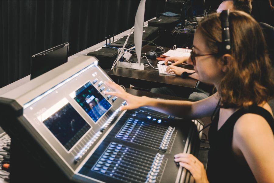Student working at a sound board. 
