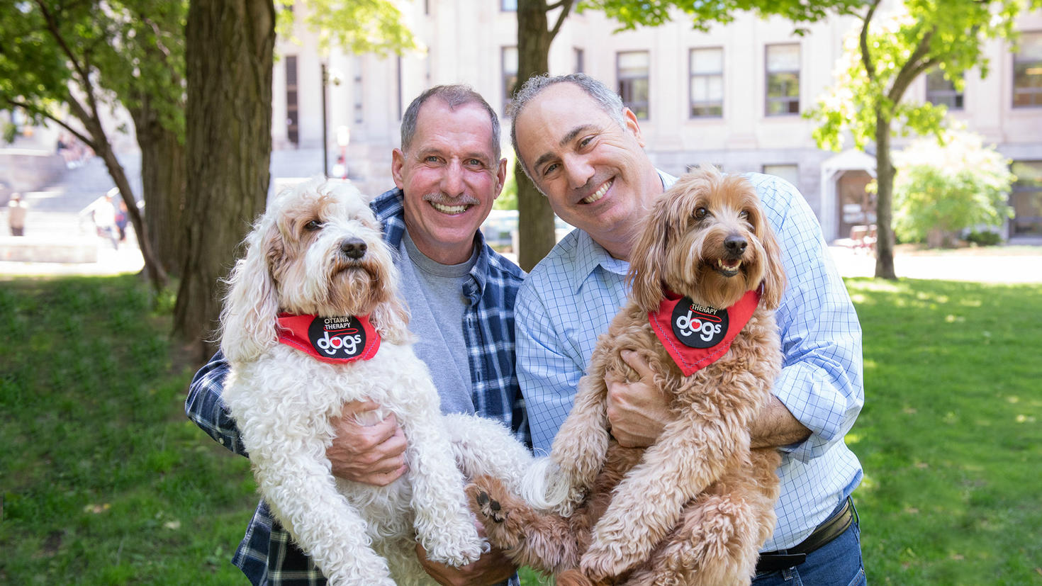 Martin Méthot, Robert Ryan and their dogs. 