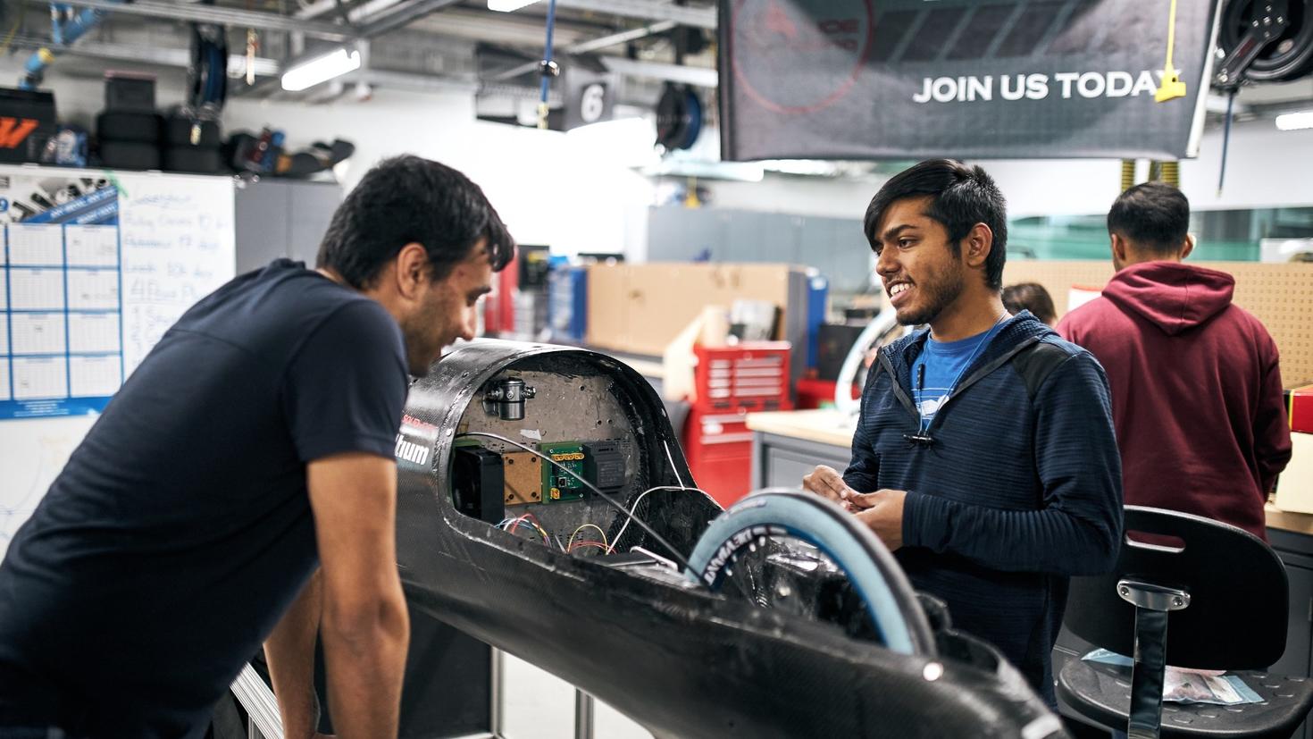 Students working on a car.