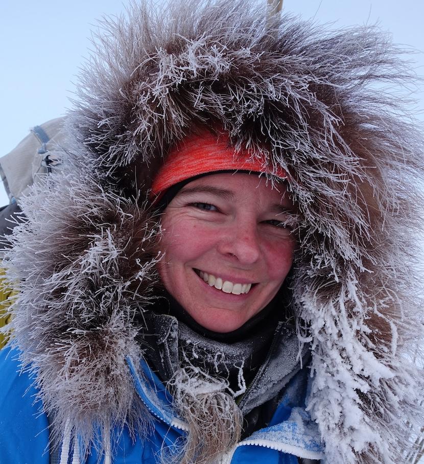 Smiling face of Pascale Marceau wearing a frozen hood.