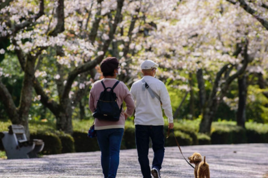 People walking their dog.