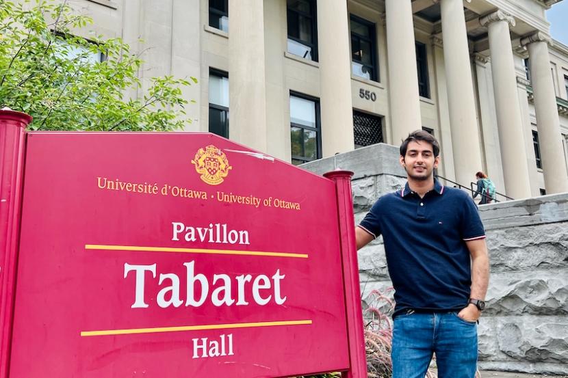 Anas Javaid in front of Tabaret Building