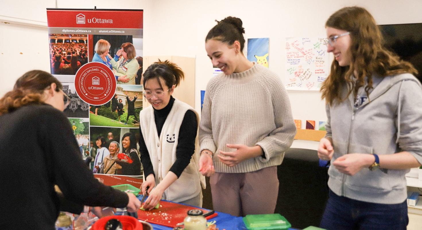 Students practise their chopping skills at a cooking workshop.