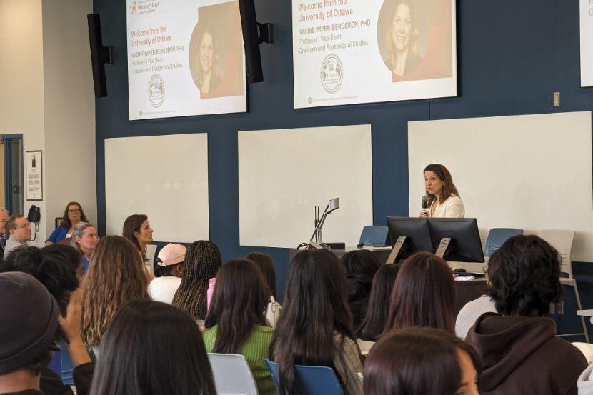 Photo of a speaker talking to students in a classroom