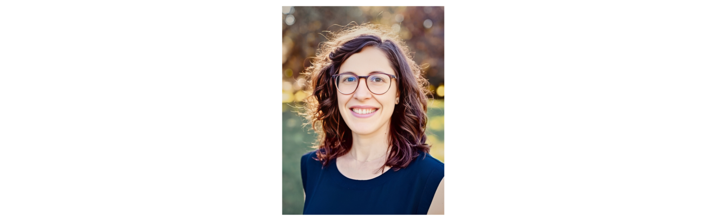 A smiling woman with glasses and a black top.