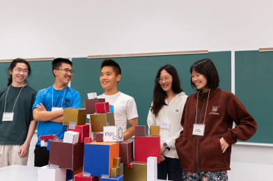 Math camp students showcasing their projects.