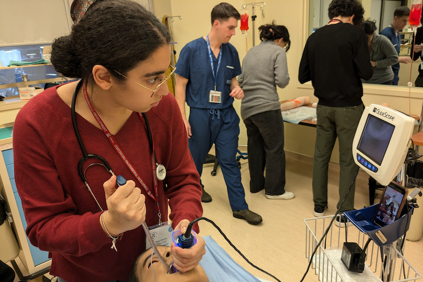 Student intubating a manikin.