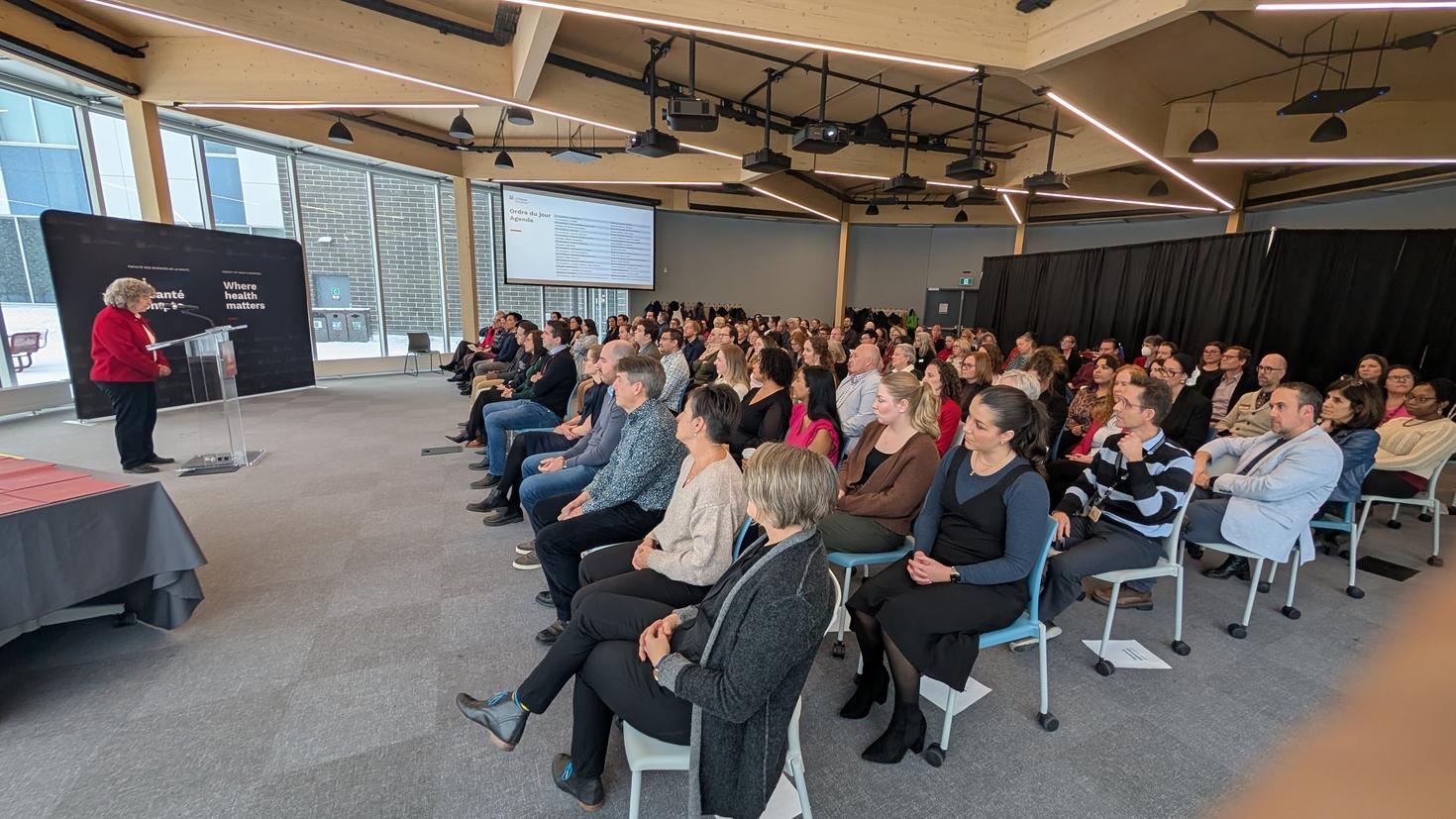 Dean Lucie Thibault making a speech in front of a crowd