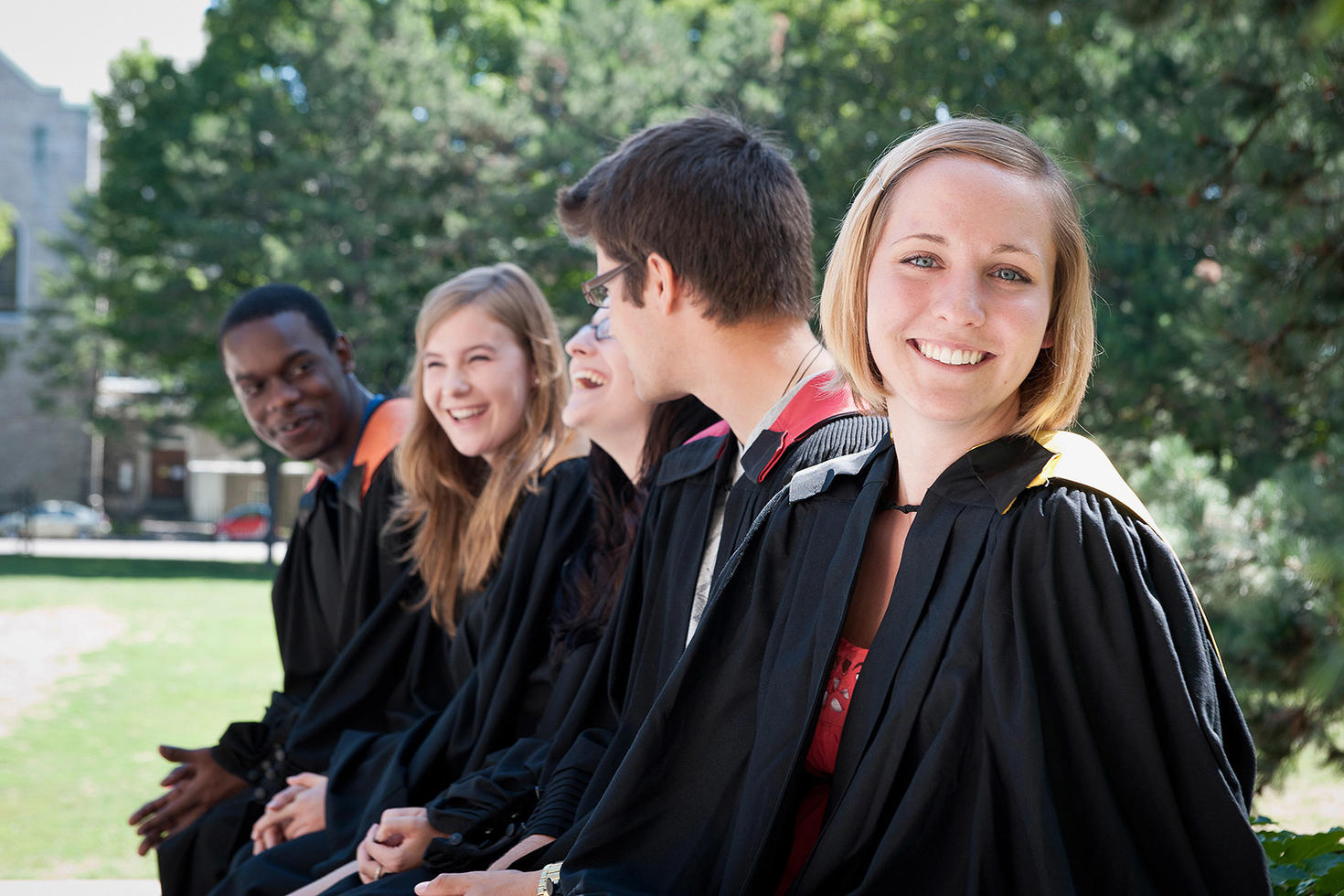 Smiling Female Student dressed in graduation toge