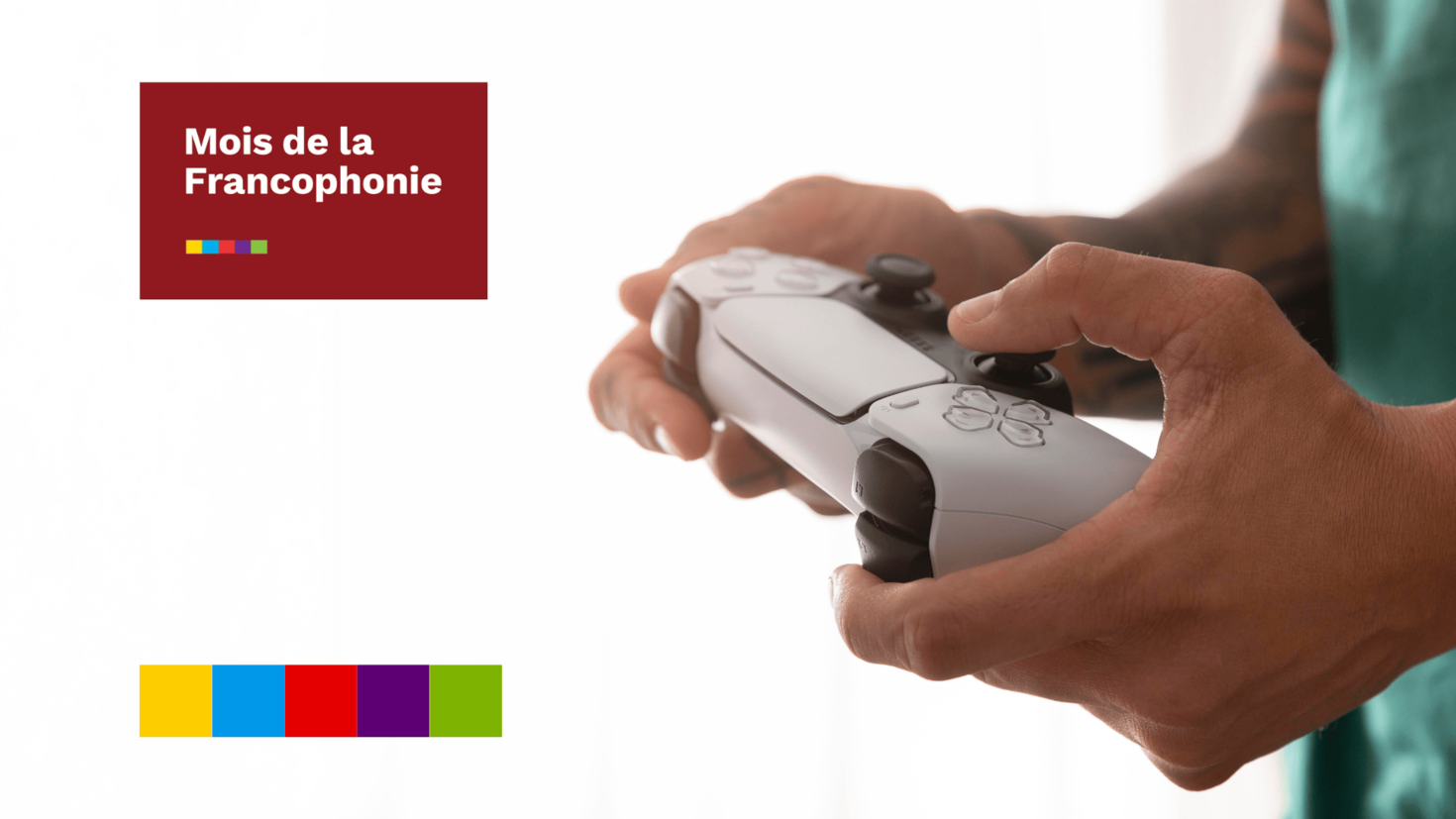 A man holding a PS5 controller