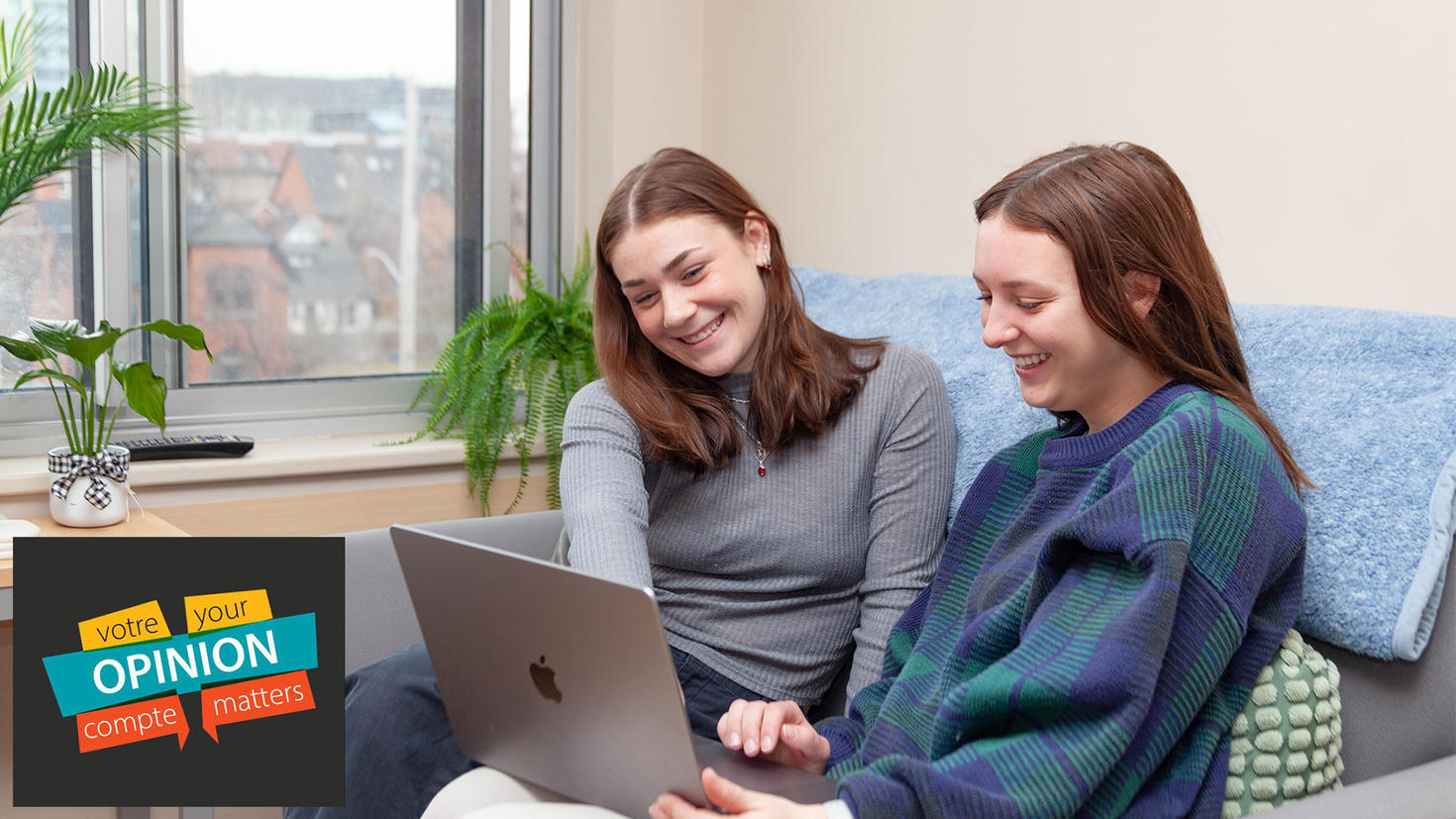 Two sitting completing course evaluation on a laptop. Image includes the Your Opinion Matters course evaluation logo.