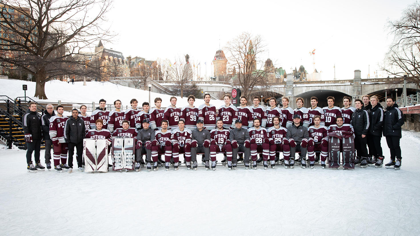 The Gee-Gees hockey team pose for a group picture on the Rideau Canal.