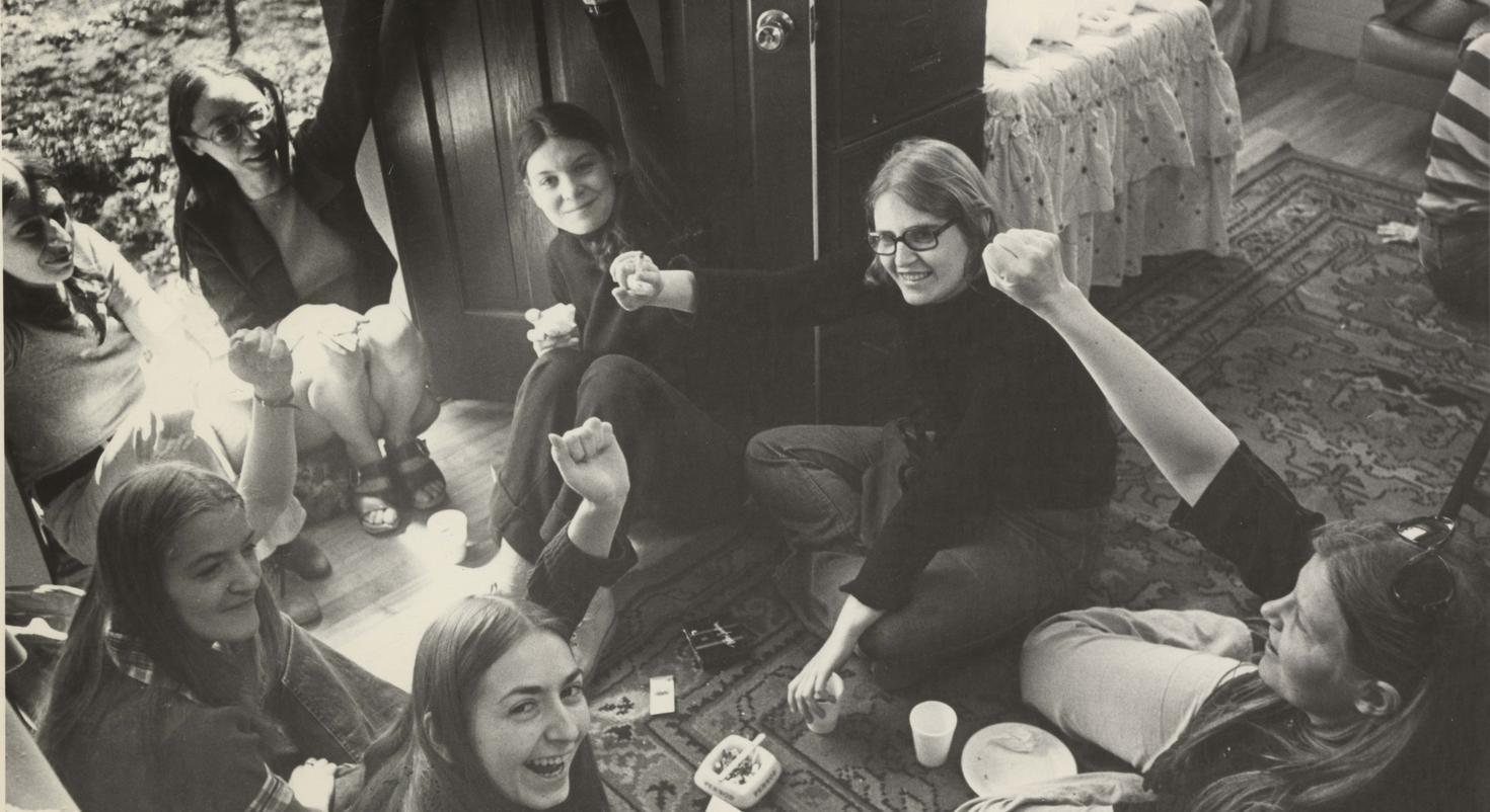 A group of women raising their hands