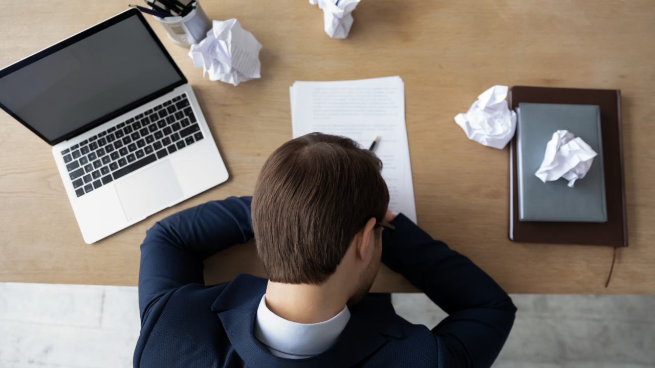 A man lying on a table, desperate