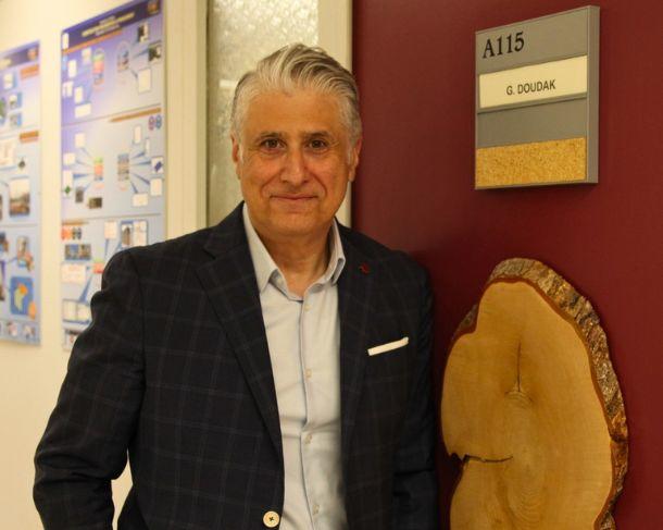 Professor Ghasan Doudak with the first piece of tinder he cut.