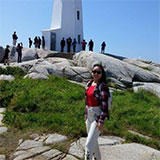 itshns standing in front of a lighthouse