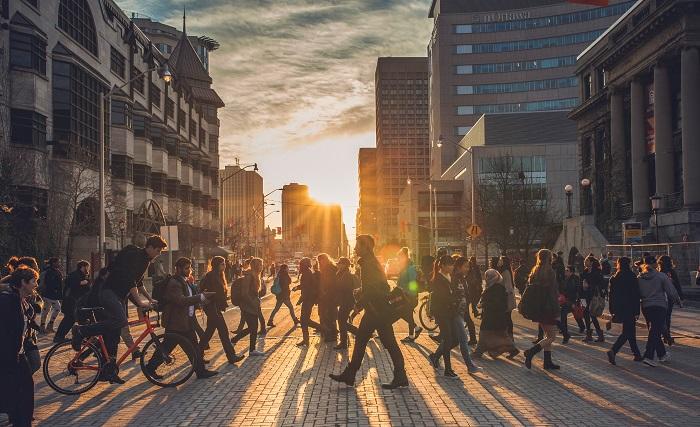 Students walking through a crosswalk.