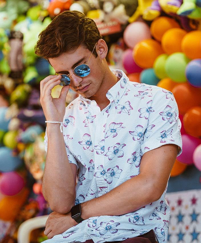 Joey Kidney against a balloon-filled backdrop.