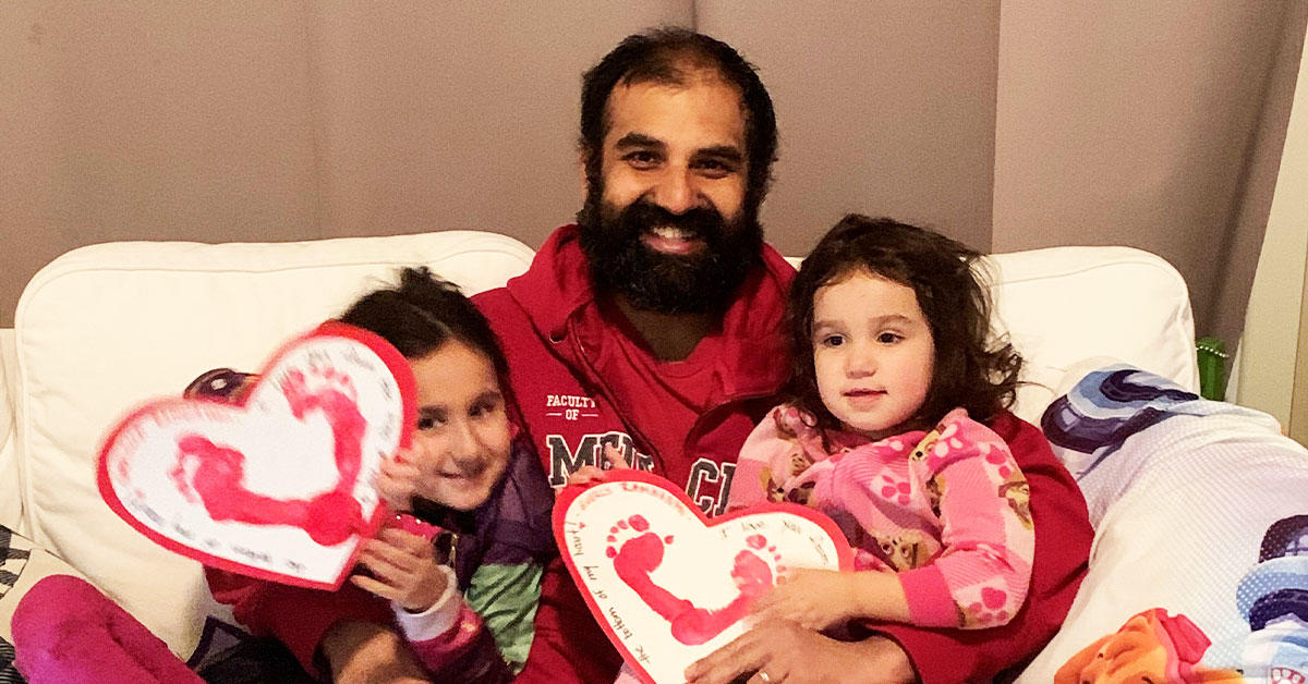 Professor Christopher Ramnanan with his two young daughters