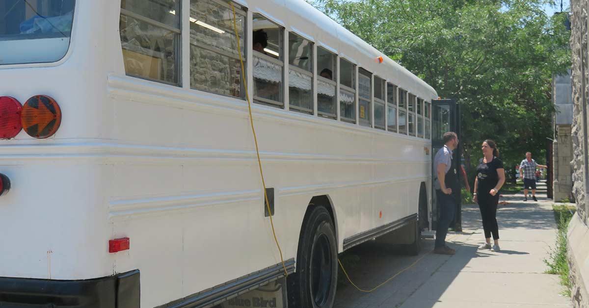 Bus seen from the back, with yellow extension cord.