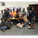 A group of black women posing in a room in front of a wihte board