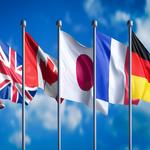 Clear blue sky in the background. 7 country flags floating 